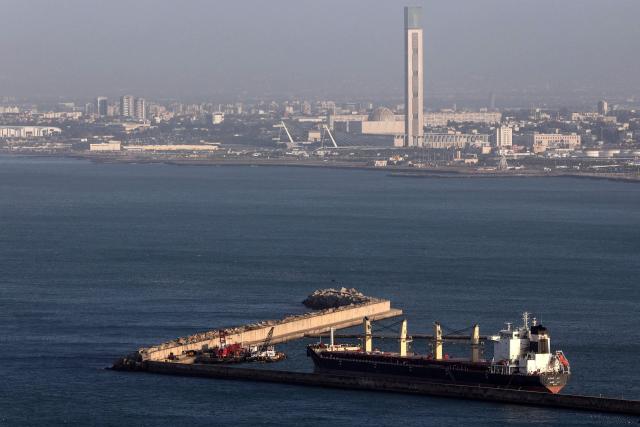 A photograph shows a ship moored along a pier in the port of Algiers with the Great Mosque  visible in the background on February 16, 2026. (Photo by AFP)
