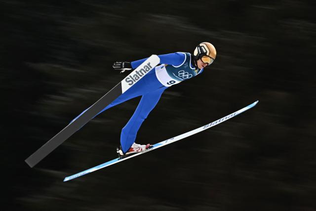Slovenia's Gasper Brecl jumps in the trial round of the ski jumping event of the nordic combined individual Gundersen large hill/10km at Predazzo Ski Jumping Stadium in Predazzo (Val di Fiemme) during the Milano Cortina 2026 Winter Olympic Games on February 17, 2026. (Photo by Javier SORIANO / AFP)