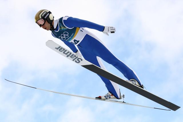 Slovenia's Vid Vrhovnik jumps in the trial round of the ski jumping event of the nordic combined individual Gundersen large hill/10km at Predazzo Ski Jumping Stadium in Predazzo (Val di Fiemme) during the Milano Cortina 2026 Winter Olympic Games on February 17, 2026. (Photo by Anne-Christine POUJOULAT / AFP)