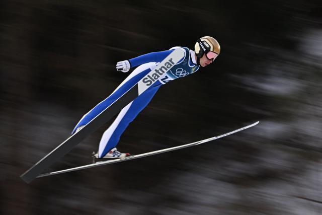 Slovenia's Vid Vrhovnik jumps in the trial round of the ski jumping event of the nordic combined individual Gundersen large hill/10km at Predazzo Ski Jumping Stadium in Predazzo (Val di Fiemme) during the Milano Cortina 2026 Winter Olympic Games on February 17, 2026. (Photo by Javier SORIANO / AFP)