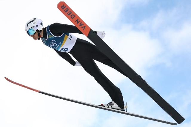 USA's Benjamin Loomis jumps in the trial round of the ski jumping event of the nordic combined individual Gundersen large hill/10km at Predazzo Ski Jumping Stadium in Predazzo (Val di Fiemme) during the Milano Cortina 2026 Winter Olympic Games on February 17, 2026. (Photo by Anne-Christine POUJOULAT / AFP)