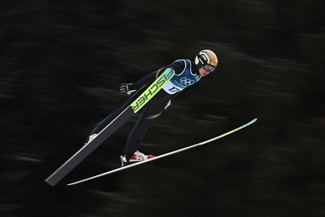 Italy's Aaron Kostner jumps in the trial round of the ski jumping event of the nordic combined individual Gundersen large hill/10km at Predazzo Ski Jumping Stadium in Predazzo (Val di Fiemme) during the Milano Cortina 2026 Winter Olympic Games on February 17, 2026. (Photo by Javier SORIANO / AFP)