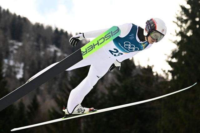 Japan's Ryota Yamamoto competes in the ski jumping event of the nordic combined individual Gundersen large hill/10km at Predazzo Ski Jumping Stadium in Predazzo (Val di Fiemme) during the Milano Cortina 2026 Winter Olympic Games on February 17, 2026. (Photo by Tobias SCHWARZ / AFP)