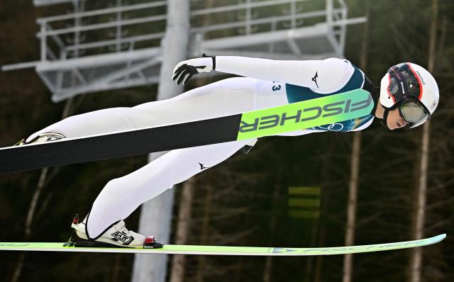 Japan's Ryota Yamamoto competes in the ski jumping event of the nordic combined individual Gundersen large hill/10km at Predazzo Ski Jumping Stadium in Predazzo (Val di Fiemme) during the Milano Cortina 2026 Winter Olympic Games on February 17, 2026. (Photo by Tobias SCHWARZ / AFP)