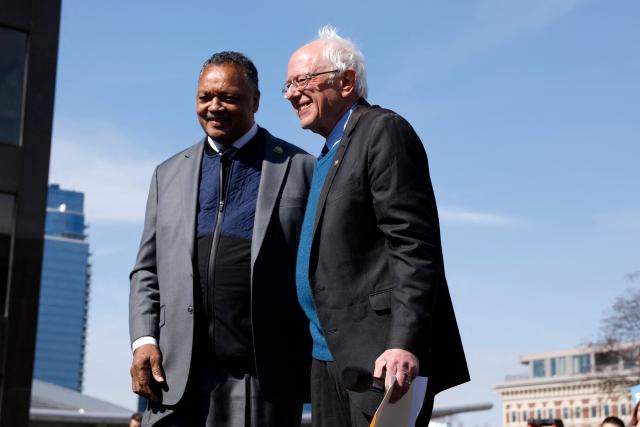 (FILES) Democratic presidential hopeful Bernie Sanders With Rev. Jesse Jackson while addressing supporters during a campaign rally in downtown Grand Rapids, Michigan, on March 8, 2020. Veteran US civil rights activist Reverend Jesse Jackson died on February 17, 2026, his family said in a statement. He was 84. (Photo by JEFF KOWALSKY / AFP)
