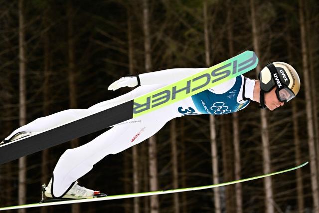 Austria's Johannes Lamparter competes in the ski jumping event of the nordic combined individual Gundersen large hill/10km at Predazzo Ski Jumping Stadium in Predazzo (Val di Fiemme) during the Milano Cortina 2026 Winter Olympic Games on February 17, 2026. (Photo by Tobias SCHWARZ / AFP)