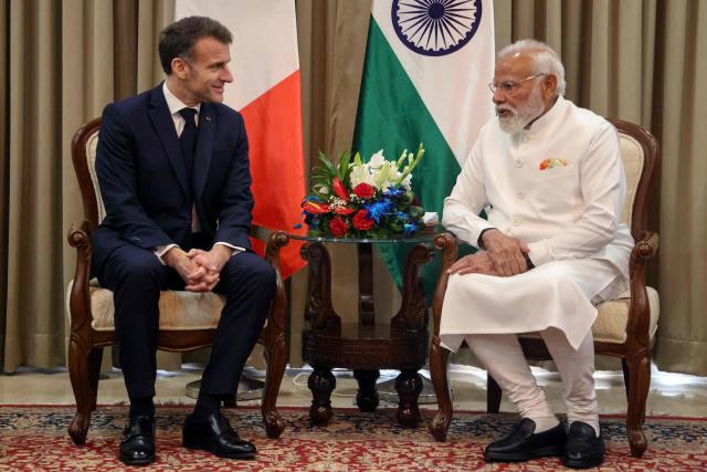 France's President Emmanuel Macron (L) and India's Prime Minister Narendra Modi take part in a bilateral meeting in Mumbai on February 17, 2026. (Photo by Ludovic MARIN / POOL / AFP)
