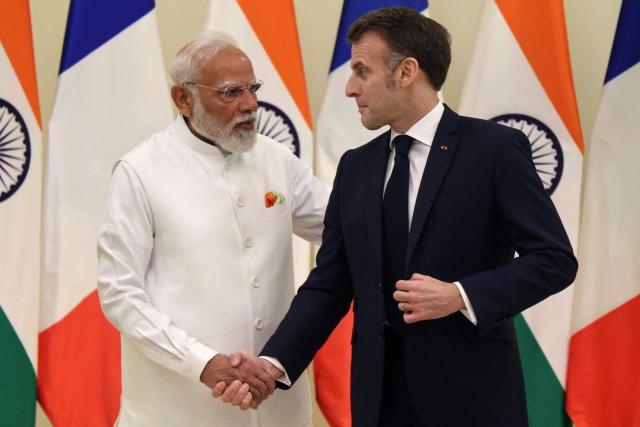 France's President Emmanuel Macron (L) and India's Prime Minister Narendra Modi shake hands as they hold a bilateral meeting in Mumbai on February 17, 2026. (Photo by Ludovic MARIN / AFP)