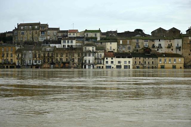 This photograph shows the Garonne river flooded in La Reole, southwestern France, on February 17, 2026. The flood alert system in France has been working at a record pace as relentless rain over the past month has saturated soils, the head of the agency told AFP on February 14, 2026. "For 30 days we have been in continuous orange or red alert somewhere on the national territory," Lucie Chadourne-Facon, director of Vigicrues, told AFP, referring to the two highest alert levels. (Photo by Gaizka IROZ / AFP)