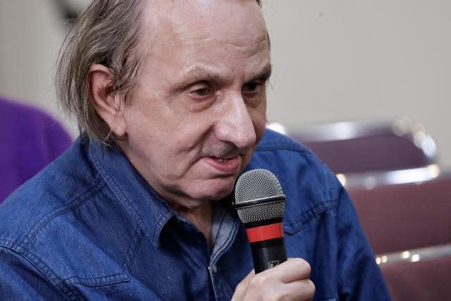 French writer Michel Houellebecq speaks as he attends a meeting on euthanasia organised by the association "Les Eligibles et leurs Aidants" as French National Assembly debates on the assisted dying bill at the 'Centre d'etude, de documentation, d'information et d'action sociale' CEDIAS in Paris on February 17, 2026. (Photo by STEPHANE DE SAKUTIN / AFP)