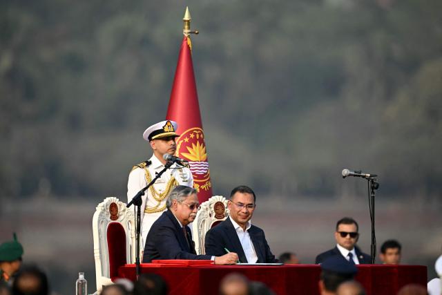Bangladesh Nationalist Party (BNP) chairman Tarique Rahman (3R) looks on after taking oath as prime minister during a swearing-in ceremony at the National Parliament building in Dhaka on February 17, 2026. Bangladesh Prime Minister Tarique Rahman was sworn into office on Februaury 17 to lead the first elected government since a deadly 2024 uprising, facing a daunting list of challenges. (Photo by MUNIR UZ ZAMAN / AFP)