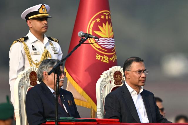 Bangladesh's newly sworn-in Prime minister Tarique Rahman (R) looks on after taking oath during a swearing-in ceremony at the National Parliament building in Dhaka on February 17, 2026. Bangladesh Prime Minister Tarique Rahman was sworn into office on Februaury 17 to lead the first elected government since a deadly 2024 uprising, facing a daunting list of challenges. (Photo by MUNIR UZ ZAMAN / AFP)