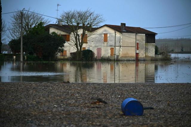 This photograph shows the Garonne river flooded in La Reole, southwestern France, on February 17, 2026. The flood alert system in France has been working at a record pace as relentless rain over the past month has saturated soils, the head of the agency told AFP on February 14, 2026. "For 30 days we have been in continuous orange or red alert somewhere on the national territory," Lucie Chadourne-Facon, director of Vigicrues, told AFP, referring to the two highest alert levels. (Photo by Gaizka IROZ / AFP)