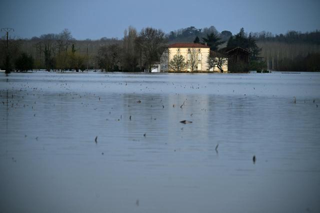 This photograph shows the Garonne river flooded in La Reole, southwestern France, on February 17, 2026. The flood alert system in France has been working at a record pace as relentless rain over the past month has saturated soils, the head of the agency told AFP on February 14, 2026. "For 30 days we have been in continuous orange or red alert somewhere on the national territory," Lucie Chadourne-Facon, director of Vigicrues, told AFP, referring to the two highest alert levels. (Photo by Gaizka IROZ / AFP)
