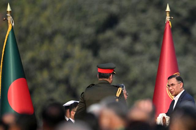 Bangladesh's newly sworn-in Prime minister Tarique Rahman (R) leaves after a swearing-in ceremony at the National Parliament building in Dhaka on February 17, 2026. Bangladesh Prime Minister Tarique Rahman was sworn into office on Februaury 17 to lead the first elected government since a deadly 2024 uprising, facing a daunting list of challenges. (Photo by MUNIR UZ ZAMAN / AFP)