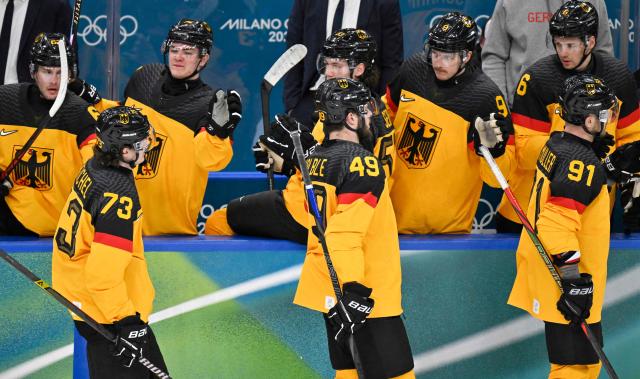 (From L) Germany's #73 Lukas Reichel, Germany's #49 Lukas Kalble and Germany's #91 Moritz Muller celebrate their team's second goal during the men's qualification play-off ice hockey match between Germany and France at the Milano Santagiulia Ice Hockey Arena during the Milano Cortina 2026 Winter Olympic Games in Milan, on February 17, 2026. (Photo by Alexander NEMENOV / AFP)