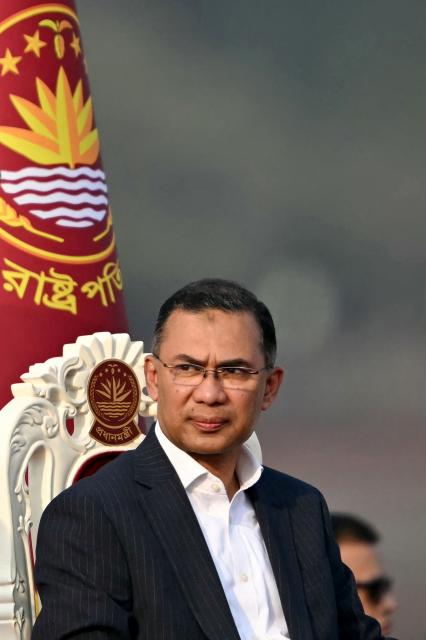 Bangladesh's newly sworn-in Prime minister Tarique Rahman looks on after taking oath during a swearing-in ceremony at the National Parliament building in Dhaka on February 17, 2026. Bangladesh Prime Minister Tarique Rahman was sworn into office on Februaury 17 to lead the first elected government since a deadly 2024 uprising, facing a daunting list of challenges. (Photo by MUNIR UZ ZAMAN / AFP)