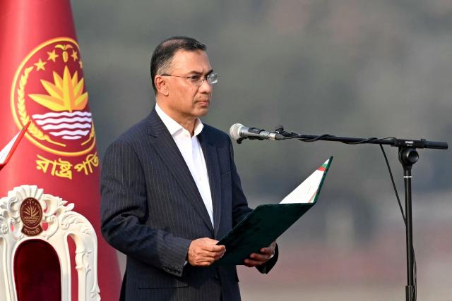 Bangladesh Nationalist Party (BNP) chairman Tarique Rahman takes oath as prime minister during a swearing-in ceremony at the National Parliament building in Dhaka on February 17, 2026. Bangladesh Prime Minister Tarique Rahman was sworn into office on Februaury 17 to lead the first elected government since a deadly 2024 uprising, facing a daunting list of challenges. (Photo by MUNIR UZ ZAMAN / AFP)