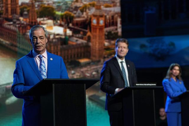 Reform UK leader Nigel Farage (L) speaks as deputy leader Richard Tice (C) and MP Suella Braverman (back R) look on during a party press conference in central London on February 17, 2026. (Photo by CARLOS JASSO / AFP)