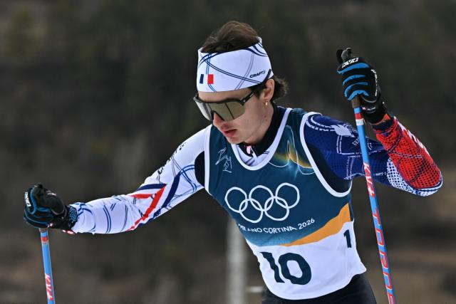 France's Marco Heinis competes in the cross-country event of the nordic combined individual Gundersen large hill/10km at Tesero Cross Country Stadium at Lago di Tesero (Val di Fiemme) during the Milano Cortina 2026 Winter Olympic Games on February 17, 2026. (Photo by Javier SORIANO / AFP)