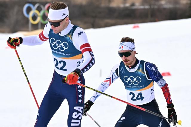 USA's Benjamin Loomis (L) and France's Mael Tyrode compete in the cross-country event of the nordic combined individual Gundersen large hill/10km at Tesero Cross Country Stadium at Lago di Tesero (Val di Fiemme) during the Milano Cortina 2026 Winter Olympic Games on February 17, 2026. (Photo by Javier SORIANO / AFP)