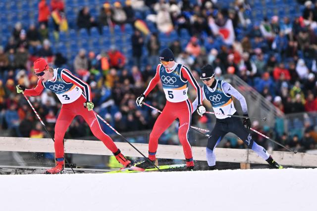 (Fro L) Norway's Andreas Skoglund, Norway's Jens Luraas Oftebro and Japan's Ryota Yamamoto compete in the cross-country event of the nordic combined individual Gundersen large hill/10km at Tesero Cross Country Stadium at Lago di Tesero (Val di Fiemme) during the Milano Cortina 2026 Winter Olympic Games on February 17, 2026. (Photo by Javier SORIANO / AFP)