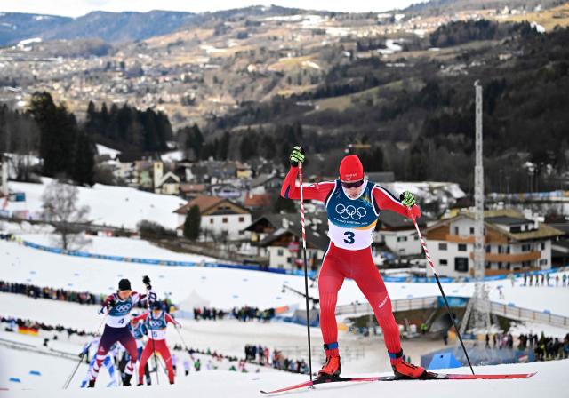 Norway's Andreas Skoglund competes in the cross-country event of the nordic combined individual Gundersen large hill/10km at Tesero Cross Country Stadium at Lago di Tesero (Val di Fiemme) during the Milano Cortina 2026 Winter Olympic Games on February 17, 2026. (Photo by Tobias SCHWARZ / AFP)