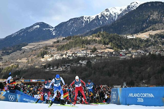 (From L) Austria's Thomas Rettenegger, Finland's Eero Hirvonen, Norway's Einar Luraas Oftebro and Estonia's Kristjan Ilves compete in the cross-country event of the nordic combined individual Gundersen large hill/10km at Tesero Cross Country Stadium at Lago di Tesero (Val di Fiemme) during the Milano Cortina 2026 Winter Olympic Games on February 17, 2026. (Photo by Javier SORIANO / AFP)