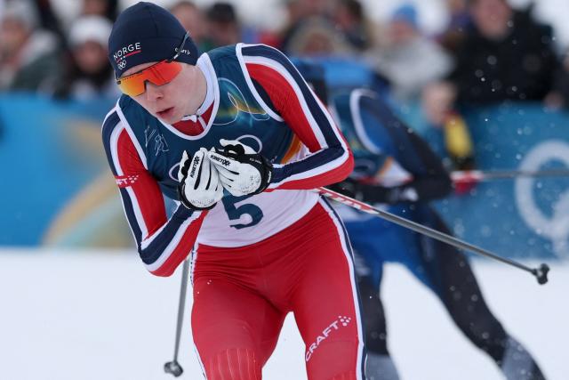 Norway's Jens Luraas Oftebro competes in the cross-country event of the nordic combined individual Gundersen large hill/10km at Tesero Cross Country Stadium at Lago di Tesero (Val di Fiemme) during the Milano Cortina 2026 Winter Olympic Games on February 17, 2026. (Photo by Anne-Christine POUJOULAT / AFP)