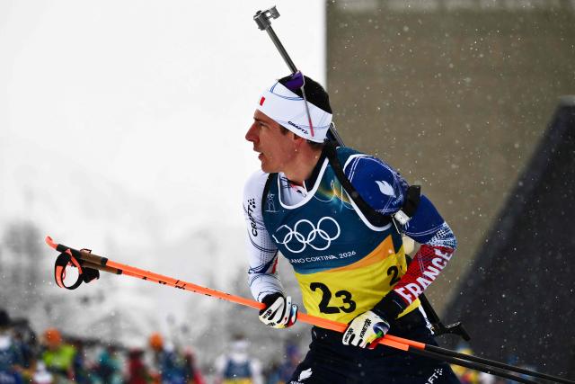 France's Quentin Fillon Maillet reacts during warm-up prior to the men's biathlon 4 x 7,5km relay event during the Milano Cortina 2026 Winter Olympic Games at the Anterselva Biathlon Arena (Sudtirol Arena) in Anterselva (Val Pusteria) on February 17, 2026. (Photo by Marco BERTORELLO / AFP)