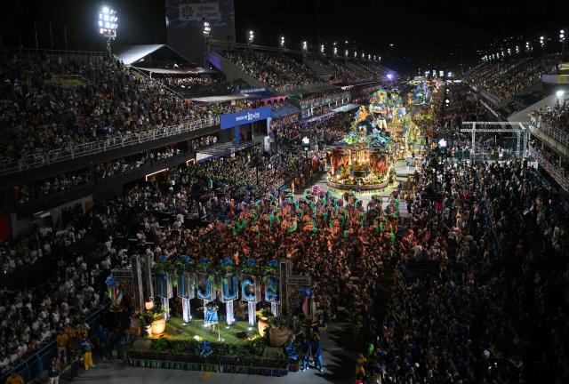 Unidos da Tijuca samba school parades during the second night of the Rio Carnival at the Marques de Sapucai Sambadrome in Rio de Janeiro, Brazil, early on February 17, 2026. (Photo by Mauro PIMENTEL / AFP)