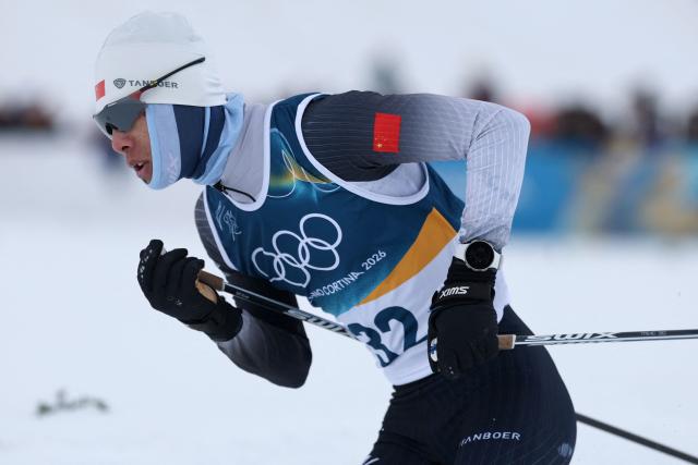China's Zhao Zihe competes in the cross-country event of the nordic combined individual Gundersen large hill/10km at Tesero Cross Country Stadium at Lago di Tesero (Val di Fiemme) during the Milano Cortina 2026 Winter Olympic Games on February 17, 2026. (Photo by Anne-Christine POUJOULAT / AFP)