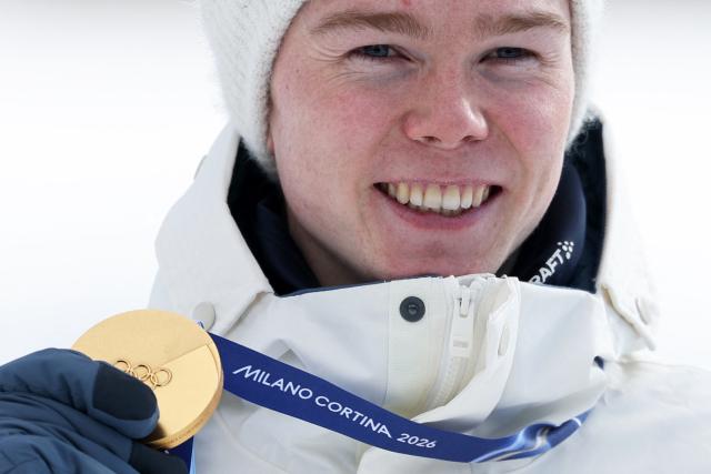 Gold medallist Norway's Jens Luraas Oftebro celebrates on the podium following the nordic combined individual Gundersen large hill/10km event at Tesero Cross Country Stadium at Lago di Tesero (Val di Fiemme) during the Milano Cortina 2026 Winter Olympic Games on February 17, 2026. (Photo by Anne-Christine POUJOULAT / AFP)
