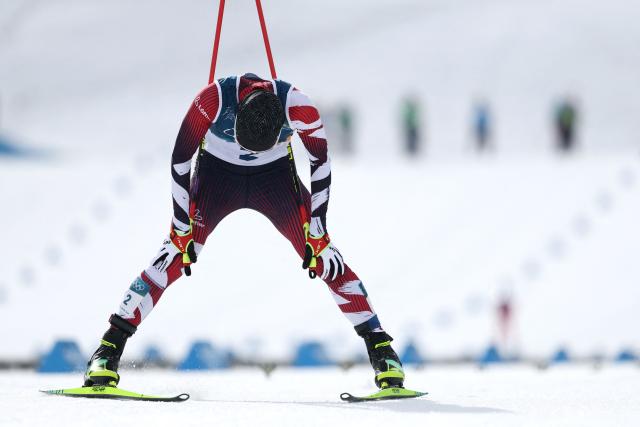 Austria's Johannes Lamparter crosses the finish to win silver in the cross-country event of the nordic combined individual Gundersen large hill/10km at Tesero Cross Country Stadium at Lago di Tesero (Val di Fiemme) during the Milano Cortina 2026 Winter Olympic Games on February 17, 2026. (Photo by Anne-Christine POUJOULAT / AFP)