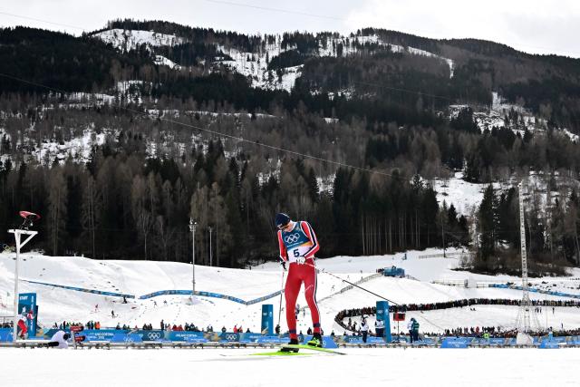 Norway's Jens Luraas Oftebro reacts after crossing the finish to win overall gold, in the cross-country event of the nordic combined individual Gundersen large hill/10km at Tesero Cross Country Stadium at Lago di Tesero (Val di Fiemme) during the Milano Cortina 2026 Winter Olympic Games on February 17, 2026. (Photo by Tobias SCHWARZ / AFP)