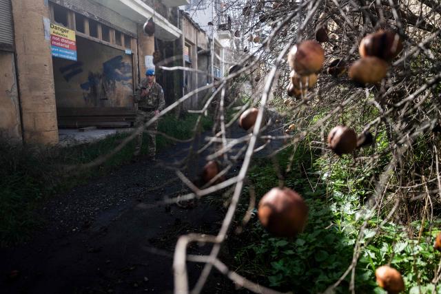 Members of the UN Peacekeeping Force in Cyprus (UNFICYP), from the British Army’s 1st Battalion Coldstream Guards, No. 2 Company, patrol along the buffer zone separating the internationally recognized Republic of Cyprus and the breakaway Turkish Republic of Northern Cyprus in the divided capital Nicosia on February 17, 2026. Cyprus has been divided since 1974, when a Turkish invasion followed a coup in Nicosia backed by Greece’s then military junta. The Turkish Republic of Northern Cyprus, declared in 1983, is recognized only by Ankara, while the internationally recognized Republic of Cyprus — a member of the European Union — controls the island’s majority Greek Cypriot south. There are currently nine crossings along the UN-patrolled Green Line separating the two sides, and calls have grown for additional crossings along the 180-kilometre (110-mile) buffer zone to ease access for people in remote areas. Thousands cross daily for work, education or medical care using the crossings operational since 2003, while reunification efforts brokered by the United Nations have remained frozen since talks collapsed in 2017. (Photo by Jewel SAMAD / AFP)