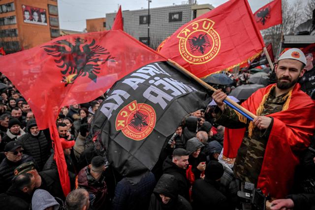 Kosovo Albanians demonstrate in support of former Kosovo Liberation Army (KLA) leaders, including former Kosovo President Hashim Thaci, on trial at The Hague's international tribunal in downtown Pristina on February 17, 2026. (Photo by Armend NIMANI / AFP)