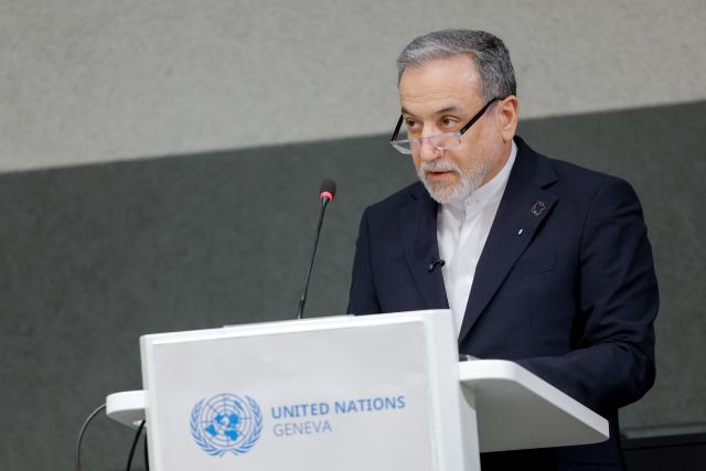 Iran's Foreign Minister Abbas Araghchi delivers a speech during a session of the United Nations Conference on Disarmament, on the sideline of a second round of US-Iranian talks with Washington pushing Tehran to make a deal to limit its nuclear programme, in Geneva, on February 17, 2026. (Photo by Valentin Flauraud / AFP)