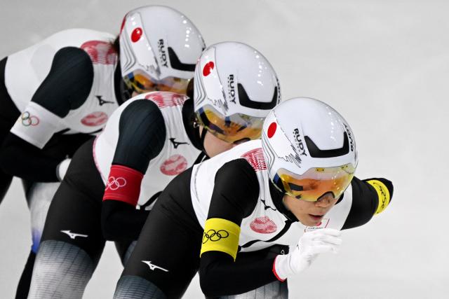 (From R) Japan's Miho Takagi, Japan's Ayano Sato and Japan's Momoka Horikawa compete in the speed skating women's team pursuit semi-final during the Milano Cortina 2026 Winter Olympic Games at Milano Speed Skating Stadium in Milan on February 17, 2026. (Photo by Daniel MUNOZ / AFP)