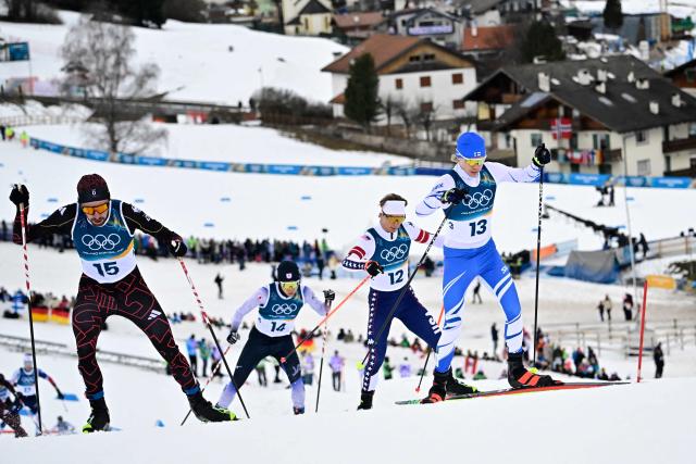 (From L) Germany's Johannes Rydzek, Japan's Sora Yachi, USA's Niklas Malacinski and Finland's Wille Karhumaa compete in the cross-country event of the nordic combined individual Gundersen large hill/10km at Tesero Cross Country Stadium at Lago di Tesero (Val di Fiemme) during the Milano Cortina 2026 Winter Olympic Games on February 17, 2026. (Photo by Tobias SCHWARZ / AFP)