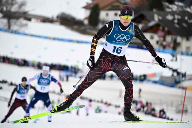 Germany's Julian Schmid competes in the cross-country event of the nordic combined individual Gundersen large hill/10km at Tesero Cross Country Stadium at Lago di Tesero (Val di Fiemme) during the Milano Cortina 2026 Winter Olympic Games on February 17, 2026. (Photo by Tobias SCHWARZ / AFP)