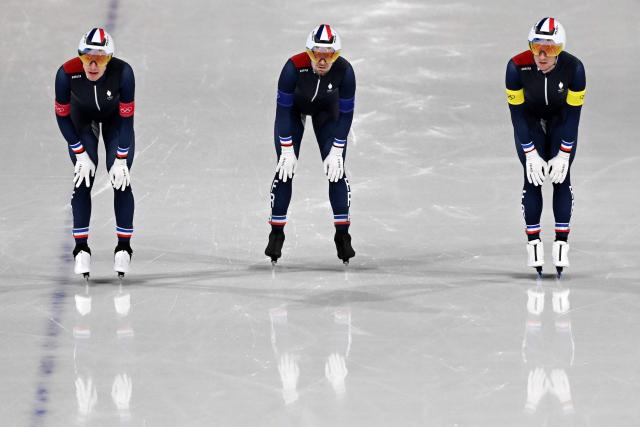 (From L) France's Timothy Loubineaud, France's Giovanni Trebouta and France's Valentin Thiebault react after competing in the speed skating men's team pursuit final C during the Milano Cortina 2026 Winter Olympic Games at Milano Speed Skating Stadium in Milan on February 17, 2026. (Photo by Daniel MUNOZ / AFP)