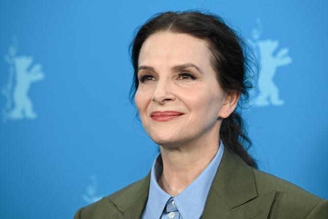 French actress Juliette Binoche poses during a photo call for the film "Queen at Sea" presented in competition at the 76th Berlinale, Europe's first major film festival of the year, in Berlin on February 17, 2026. (Photo by RALF HIRSCHBERGER / AFP)