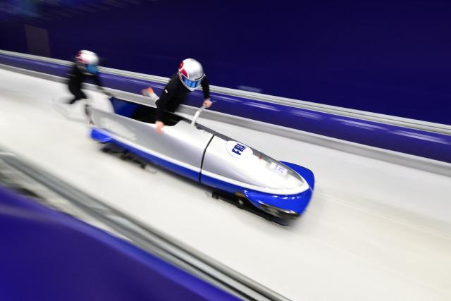 France's Margot Boch (R) take part in the bobsleigh women's 2-woman training session at Cortina Sliding Centre during the Milano Cortina 2026 Winter Olympic Games in Cortina d'Ampezzo on February 17, 2026. (Photo by Stefano RELLANDINI / AFP)