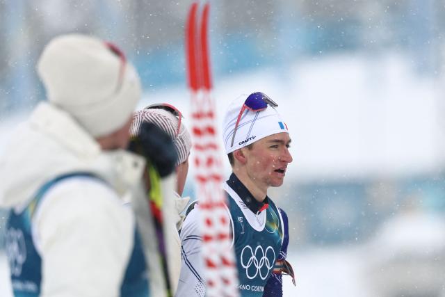 France's Eric Perrot reacts after crossing the finish line to win the men's biathlon 4 x 7,5km relay event during the Milano Cortina 2026 Winter Olympic Games at the Anterselva Biathlon Arena (Sudtirol Arena) in Anterselva (Val Pusteria) on February 17, 2026. (Photo by FRANCK FIFE / AFP)