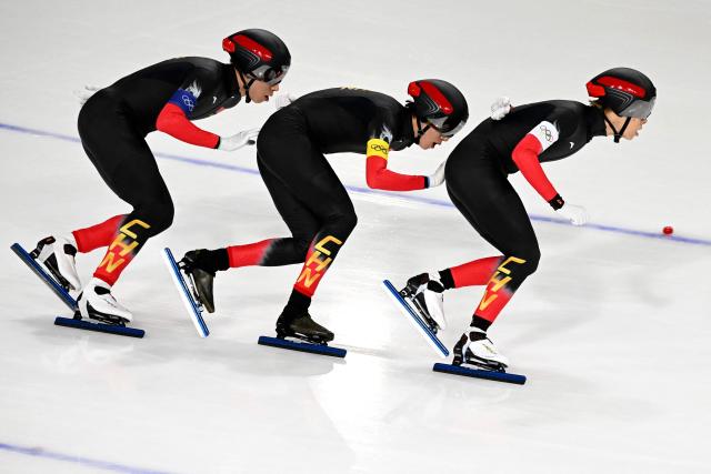 (From L) China's Li Wenhao, China's Wu Yu and China's Liu Hanbin compete in the speed skating men's team pursuit final B during the Milano Cortina 2026 Winter Olympic Games at Milano Speed Skating Stadium in Milan on February 17, 2026. (Photo by Daniel MUNOZ / AFP)