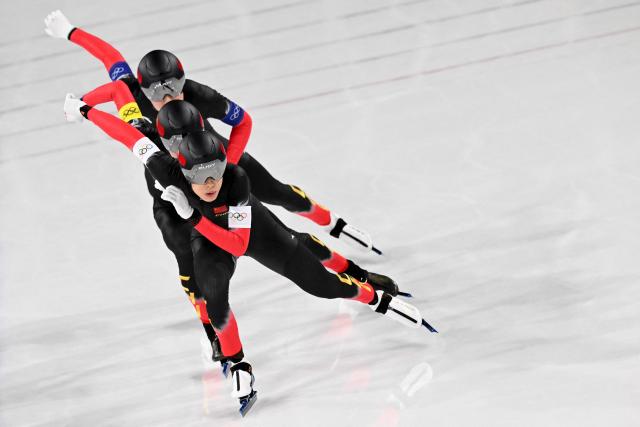 (From front) China's Li Wenhao, China's Wu Yu and China's Liu Hanbin compete in the speed skating men's team pursuit final B during the Milano Cortina 2026 Winter Olympic Games at Milano Speed Skating Stadium in Milan on February 17, 2026. (Photo by Daniel MUNOZ / AFP)