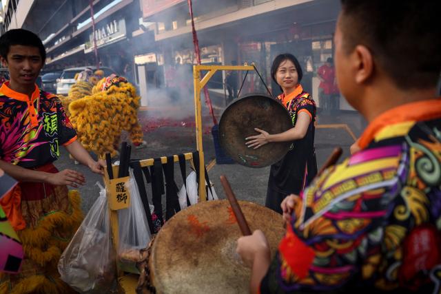 People get ready to perform a lion dance outside a restaurant during Lunar New Year celebrations marking the beginning of the Year of the Horse, in Panama City on February 17, 2026. (Photo by MARTIN BERNETTI / AFP)
