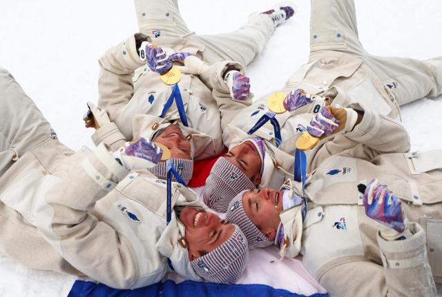 (From L) Gold medallists France's Quentin Fillon Maillet, France's Emilien Jacquelin, France's Eric Perrot and Belgium's Florent Claude celebrate following the podium ceremony after competing in the men's biathlon 4 x 7,5km relay event during the Milano Cortina 2026 Winter Olympic Games at the Anterselva Biathlon Arena (Sudtirol Arena) in Anterselva (Val Pusteria) on February 17, 2026. (Photo by Franck FIFE / AFP)