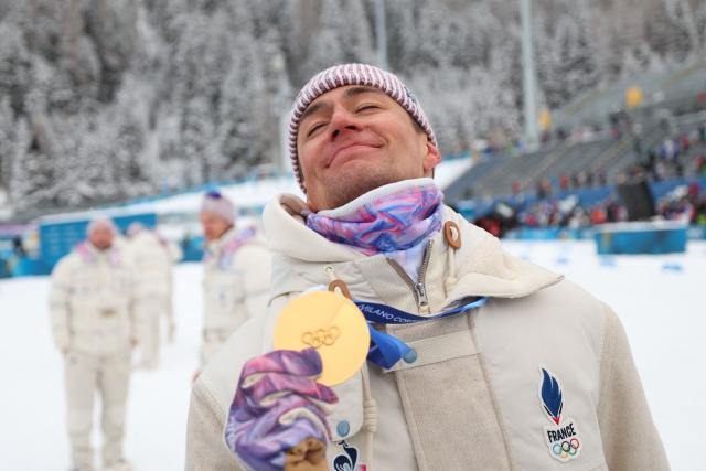 Gold medallist France's Eric Perrot celebrates after competing in the men's biathlon 4 x 7,5km relay event during the Milano Cortina 2026 Winter Olympic Games at the Anterselva Biathlon Arena (Sudtirol Arena) in Anterselva (Val Pusteria) on February 17, 2026. (Photo by FRANCK FIFE / AFP)